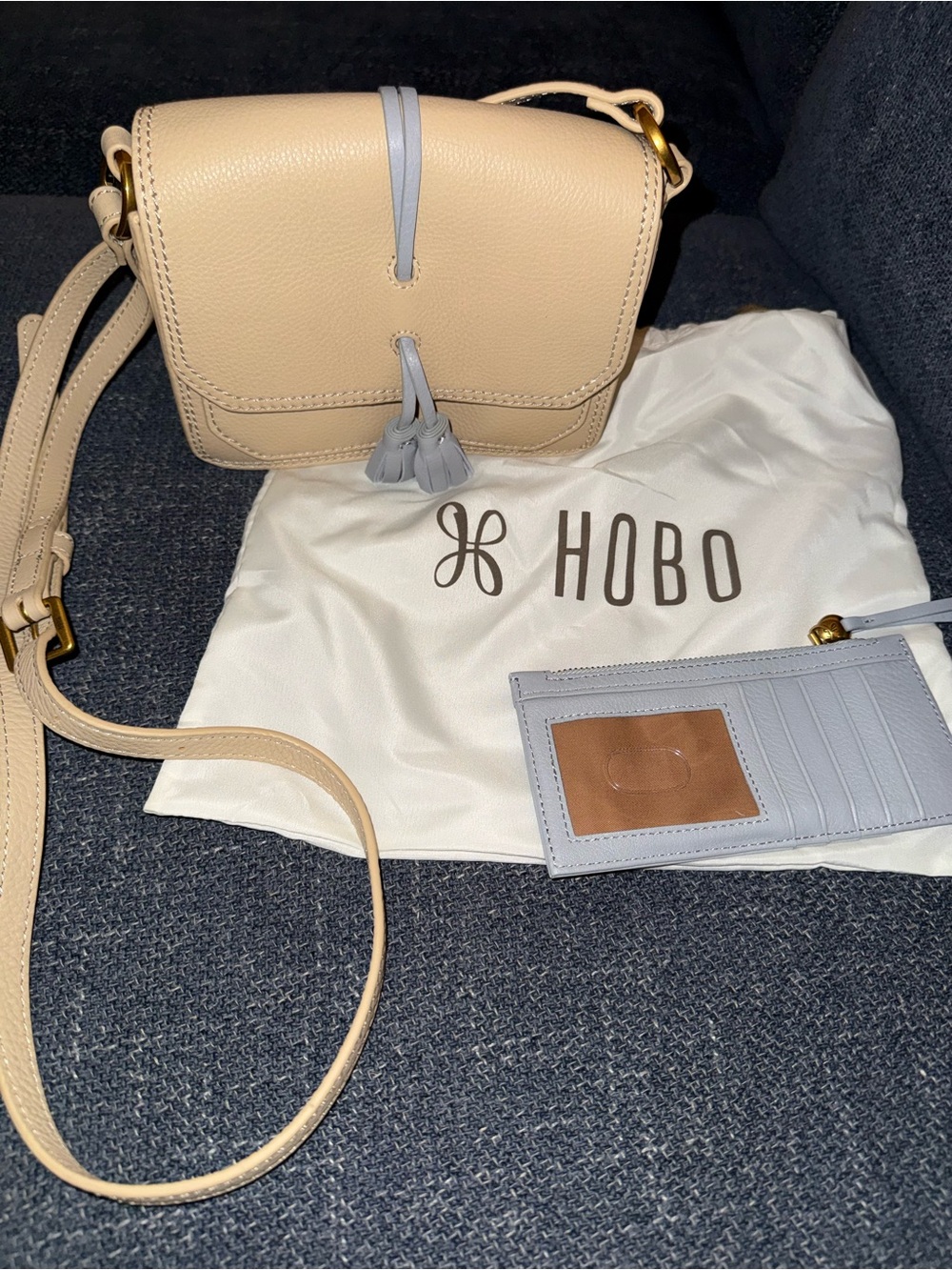 HOBO Cream Pebble Leather Crossbody with Light Gray Tassel